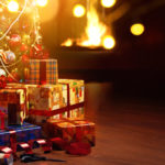 Christmas tree and holidays present on fireplace background