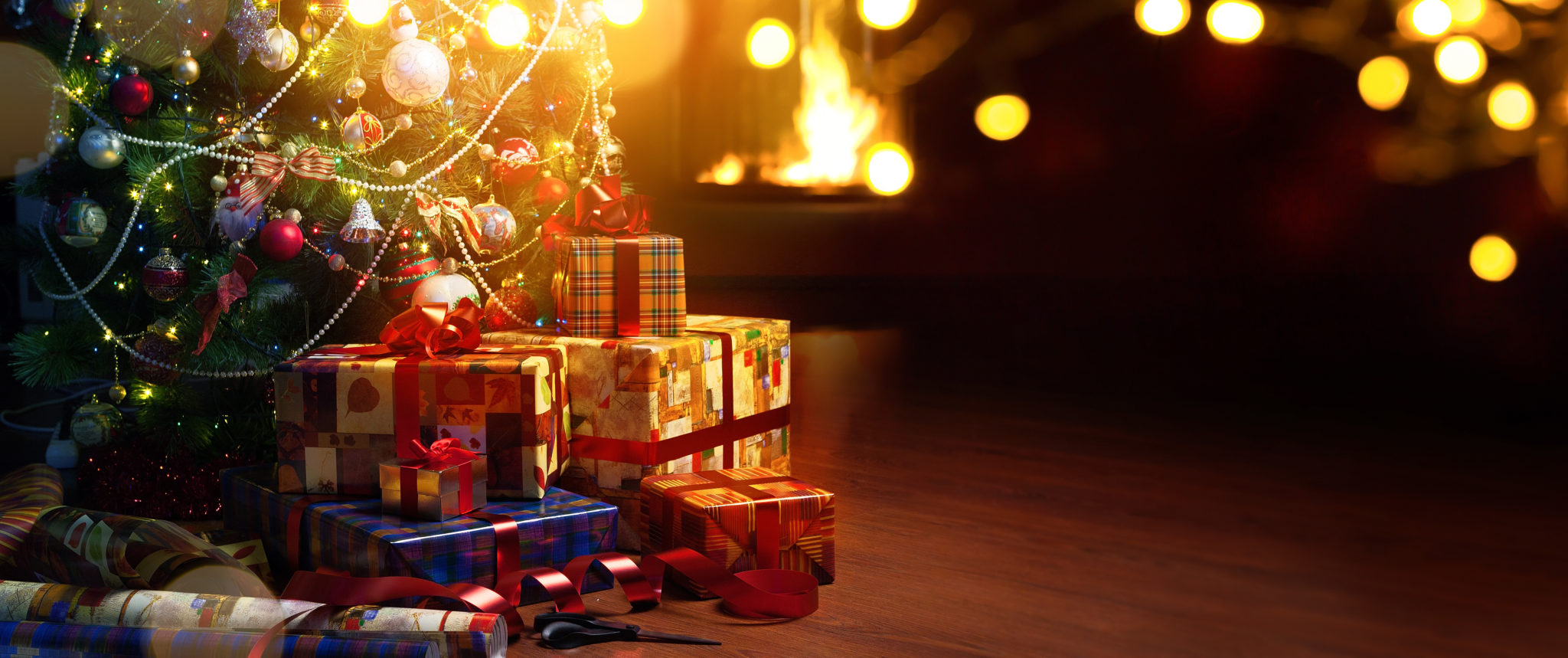 Christmas tree and holidays present on fireplace background